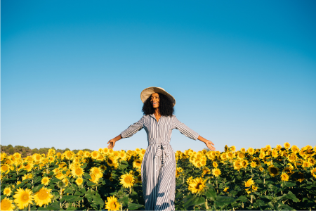 happy woman in sunflower field