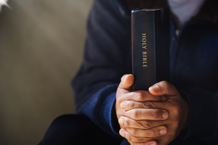 man holding bible