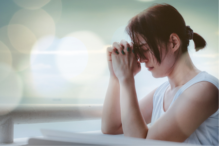 woman saying prayers for financial breakthrough