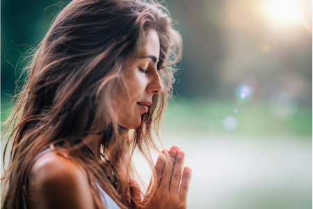 woman saying prayers for financial breakthrough