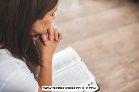 mother praying with bible