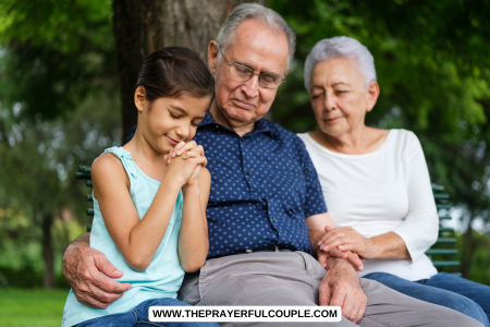 grandparents and child praying