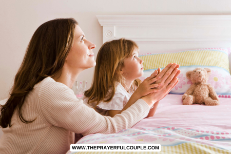 woman praying with her granddaughter