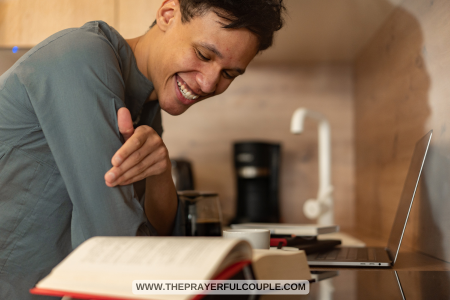 man reading Bible and smiling