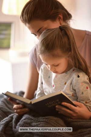 Mother and daughter read the Bible