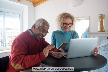 old man and woman with laptop smiling at a funny Bible verse