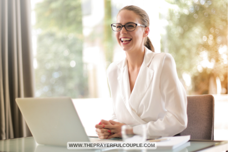 woman with laptop laughing at funny Bible quotes