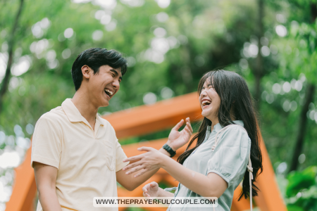 young man and woman laughing at funny Bible jokes in park