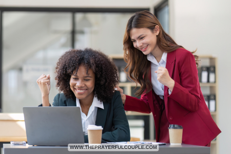 2 excited women working with a laptop