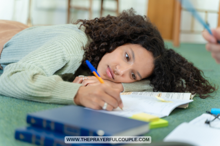 young lady lazily doing homework
